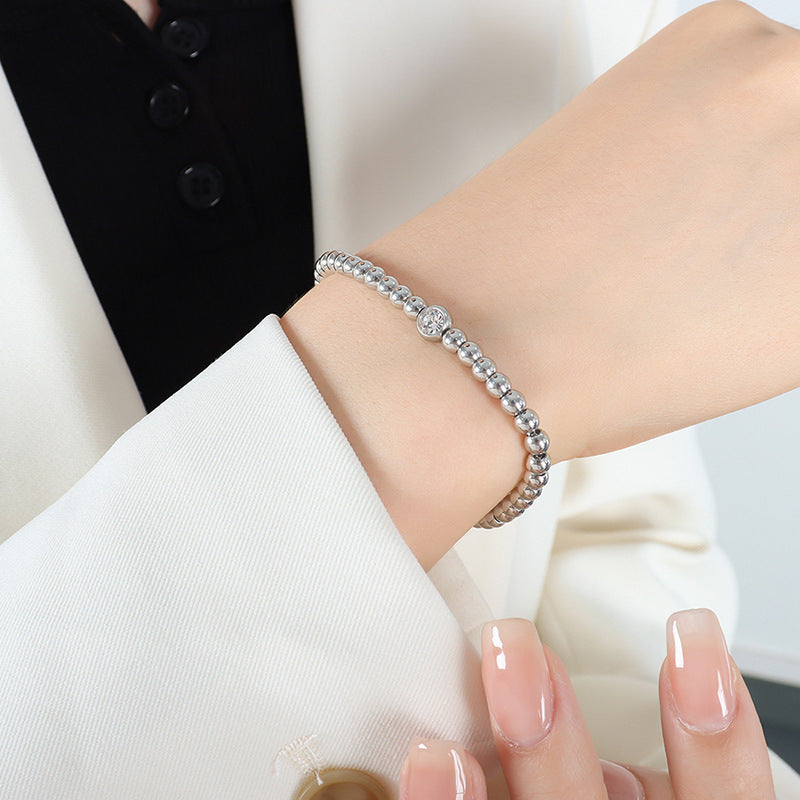 Edles und schillerndes Set aus Armband und Halskette aus 18-karätigem vergoldetem Edelstahl mit runden eingelegten Zirkonperlen